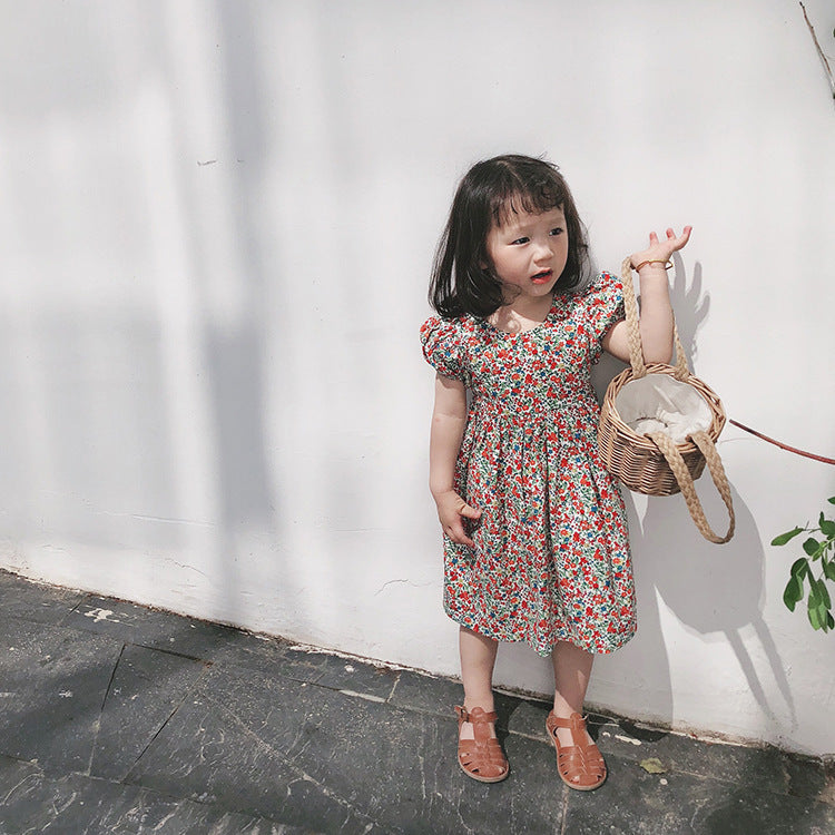 Girls carefully cross the floral dress