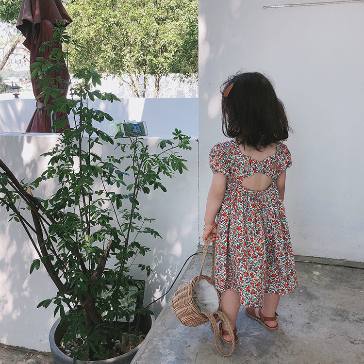 Girls carefully cross the floral dress