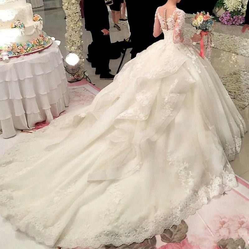 Robe de mariée sexy à manches longues princesse boutonnée au dos